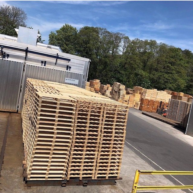 Stacks of newly manufactured wooden pallets for industrial applications